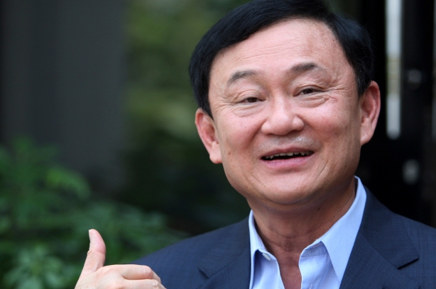 Thailand's former premier Thaksin Shinawatra gestures as he speaks to journalists outside his home in Dubai, after Puea Thai Party's Yingluck Shinawatra announced her coalition in Bangkok July 4, 2011. Exiled former Thai prime minister Thaksin said on Monday he had no wish to become prime minister again in the wake of a landslide election victory for his sister's opposition party. Thaksin, a billionaire twice elected premier, was ousted in a 2006 coup. (REUTERS/Jumana El Heloueh)